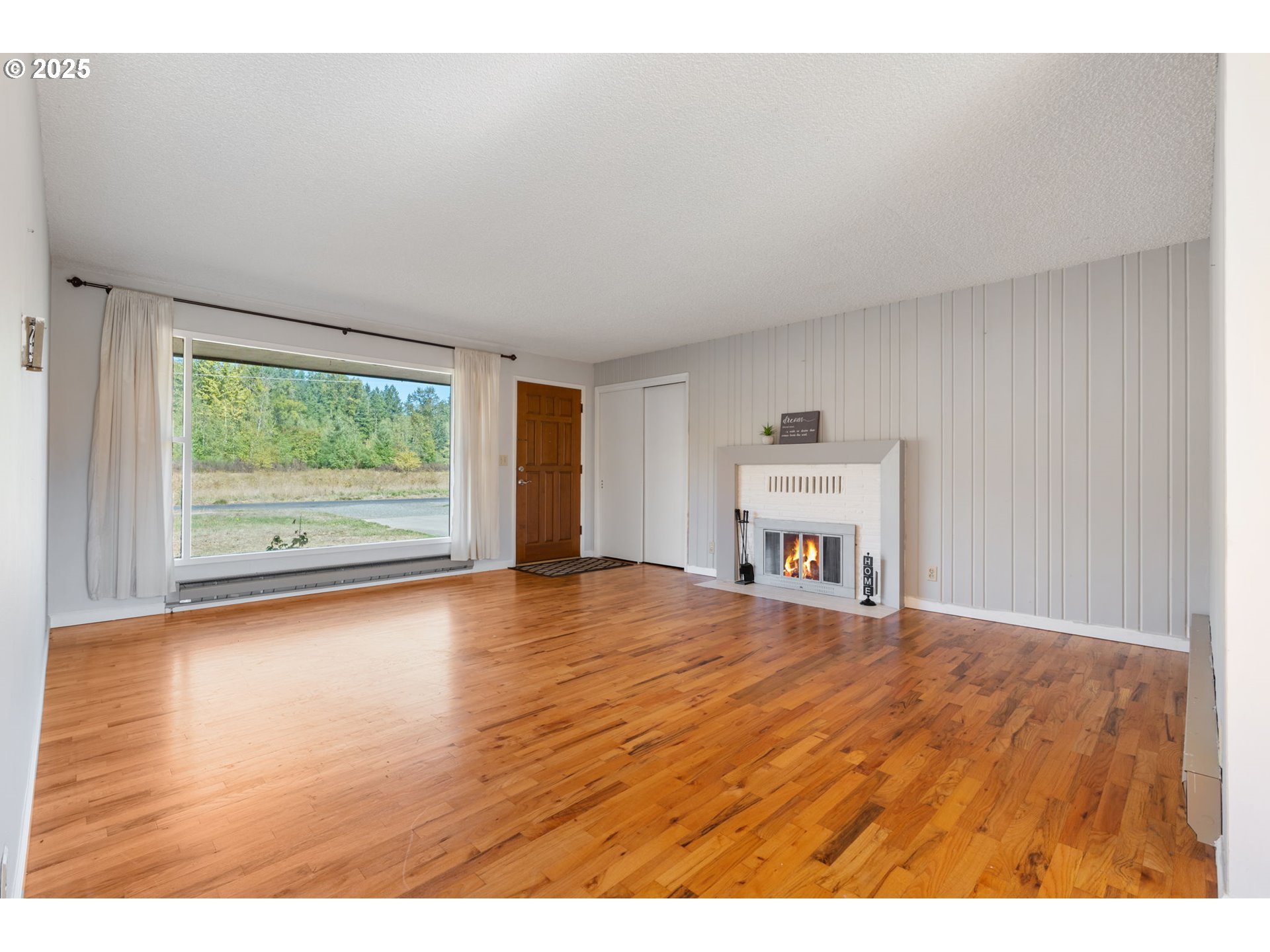 122 Armstrong Road Chehalis, WA 98532 - Photo 6 of 40 a view of a room with window and wooden floor