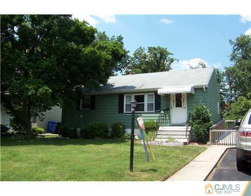 36 West Hill Road Colonia, NJ 07067 - Photo 1 of 14 a view of a house with backyard sitting area and garden