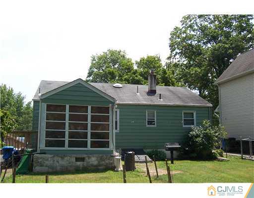 36 West Hill Road Colonia, NJ 07067 - Photo 2 of 14 a front view of a house with a yard