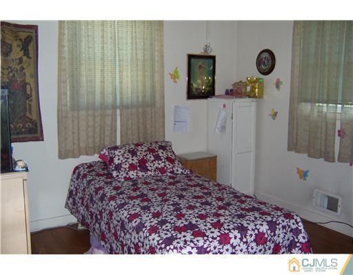 36 West Hill Road Colonia, NJ 07067 - Photo 11 of 14 a bedroom with a bed and a window