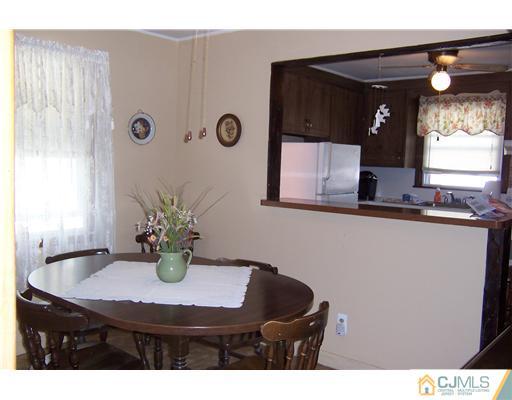36 West Hill Road Colonia, NJ 07067 - Photo 5 of 14 a kitchen with a table and chairs in it