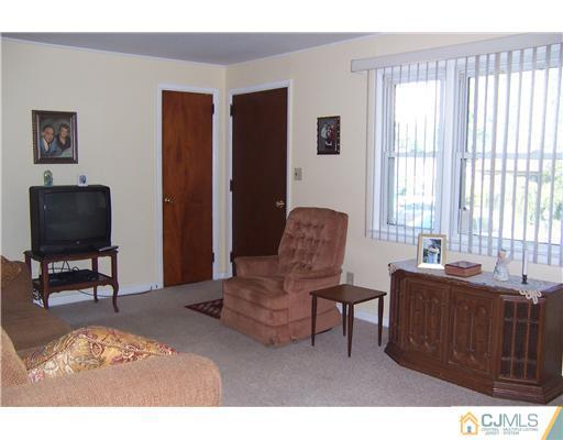36 West Hill Road Colonia, NJ 07067 - Photo 7 of 14 a living room with furniture and a window