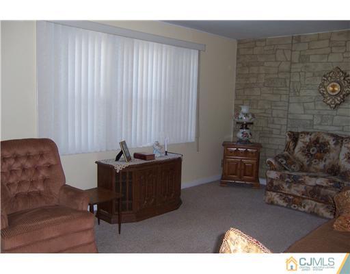 36 West Hill Road Colonia, NJ 07067 - Photo 8 of 14 a living room with furniture and a flat screen tv