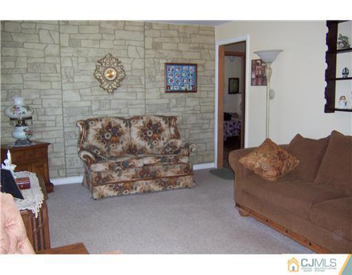36 West Hill Road Colonia, NJ 07067 - Photo 9 of 14 a living room with furniture and a wooden floor