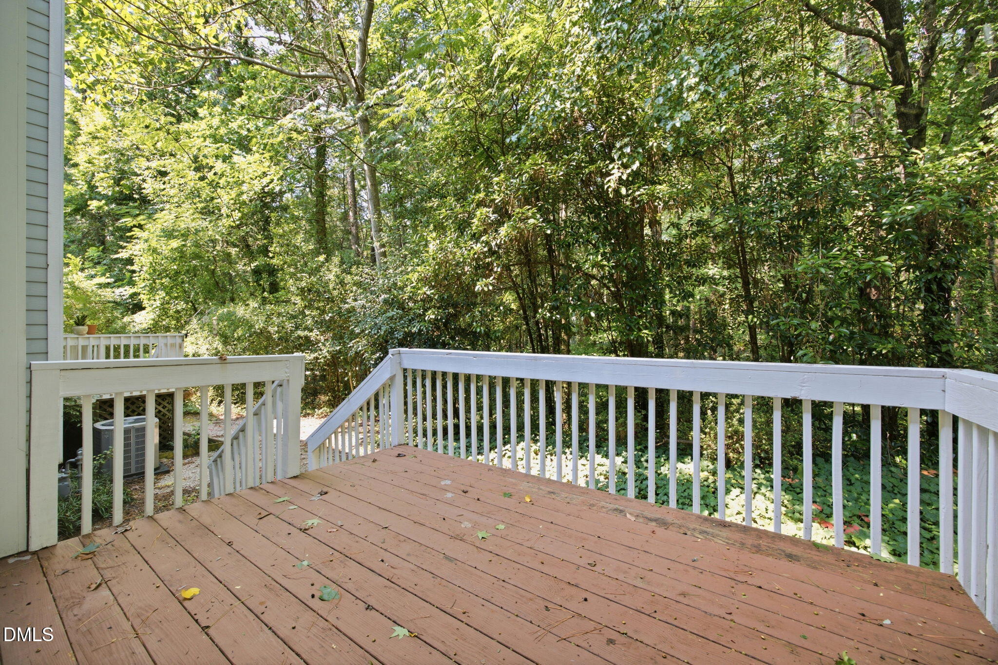 8211 Hempshire Place, Unit 104 Raleigh, NC 27613 - Photo 4 of 34 PRIVATE Back deck overlooking a natural wooded area