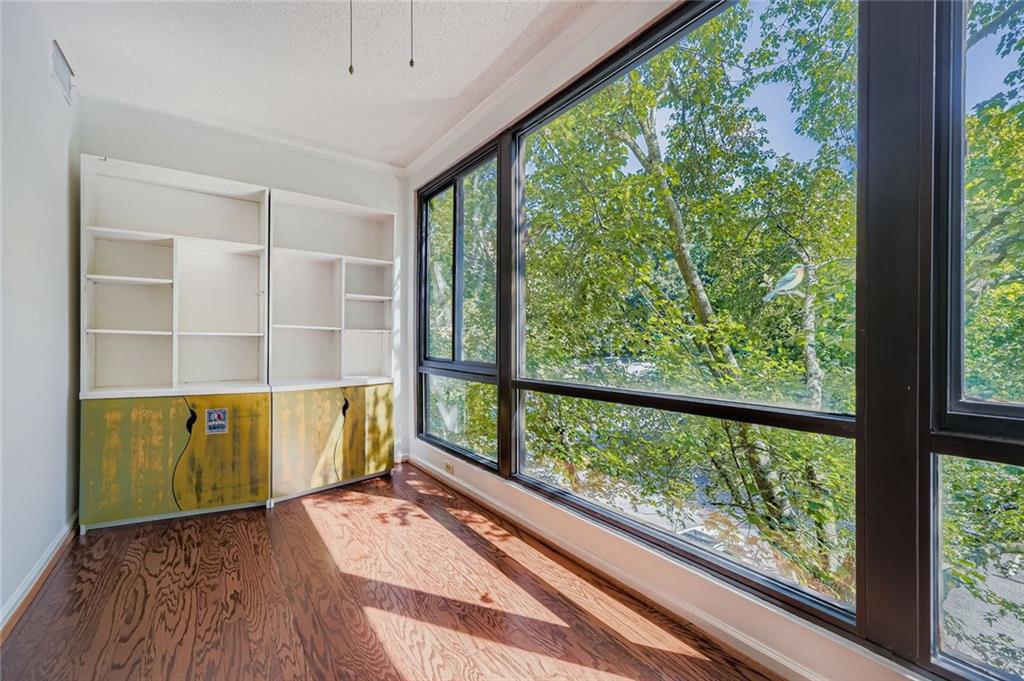 1800 Clairmont Lake, Unit A325 Decatur, GA 30033 - Photo 14 of 51 a view of a room with wooden floor and windows