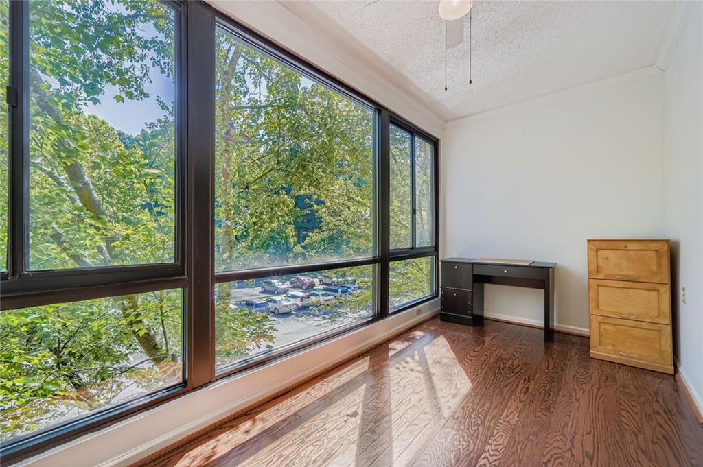 1800 Clairmont Lake, Unit A325 Decatur, GA 30033 - Photo 15 of 51 a view of a room with a window and wooden floor