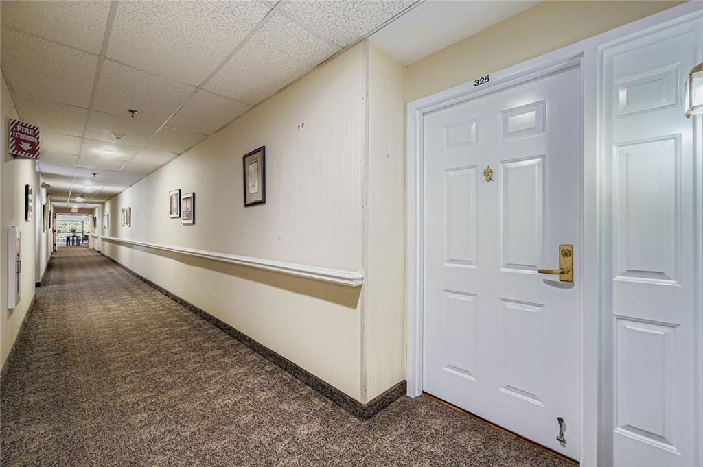 1800 Clairmont Lake, Unit A325 Decatur, GA 30033 - Photo 16 of 51 a view of a hallway with staircase
