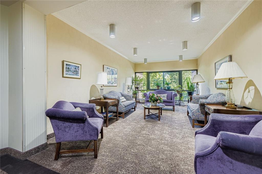 1800 Clairmont Lake, Unit A325 Decatur, GA 30033 - Photo 19 of 51 a living room with furniture and a large window