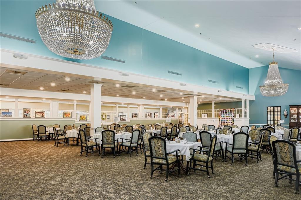 1800 Clairmont Lake, Unit A325 Decatur, GA 30033 - Photo 23 of 51 a room with lots of chairs and chandelier