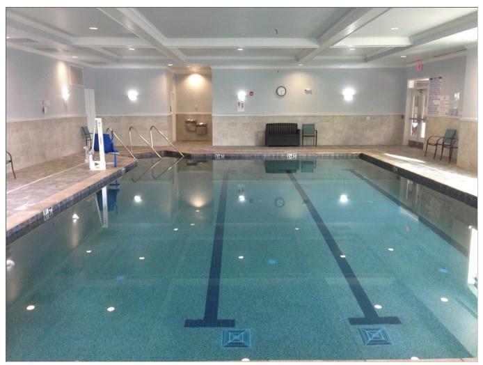 1800 Clairmont Lake, Unit A325 Decatur, GA 30033 - Photo 26 of 51 a view of a lobby with a large screen tv and stove
