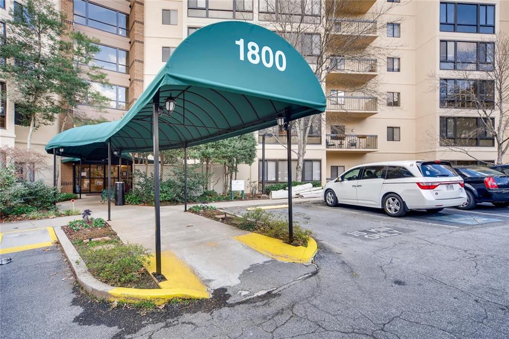 1800 Clairmont Lake, Unit A325 Decatur, GA 30033 - Photo 27 of 51 a view of a white house with a swimming pool