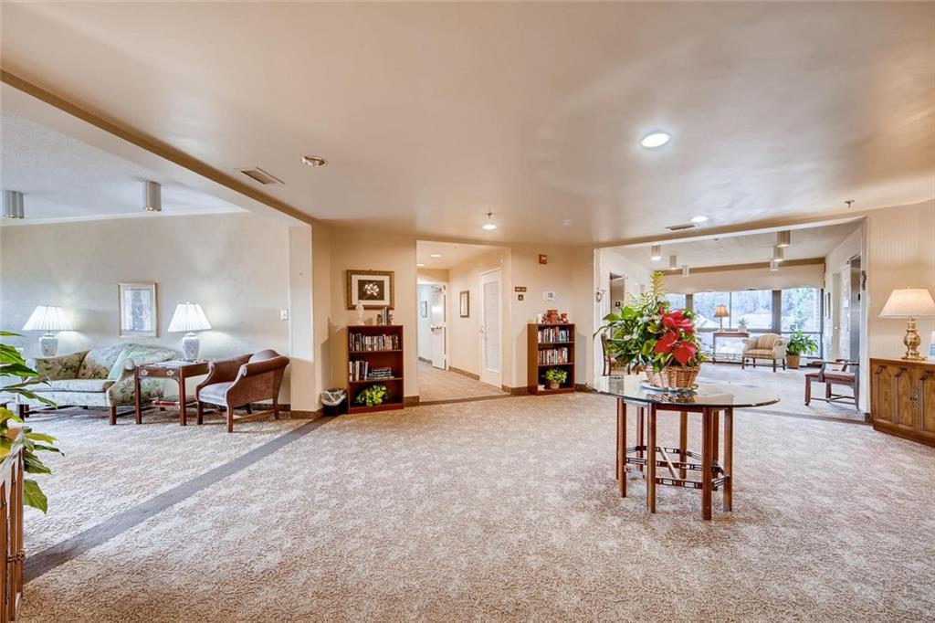 1800 Clairmont Lake, Unit A325 Decatur, GA 30033 - Photo 29 of 51 a living room with furniture and a flat screen tv