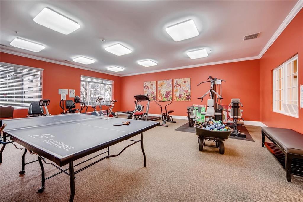 1800 Clairmont Lake, Unit A325 Decatur, GA 30033 - Photo 33 of 51 a living room with furniture a rug and a large window