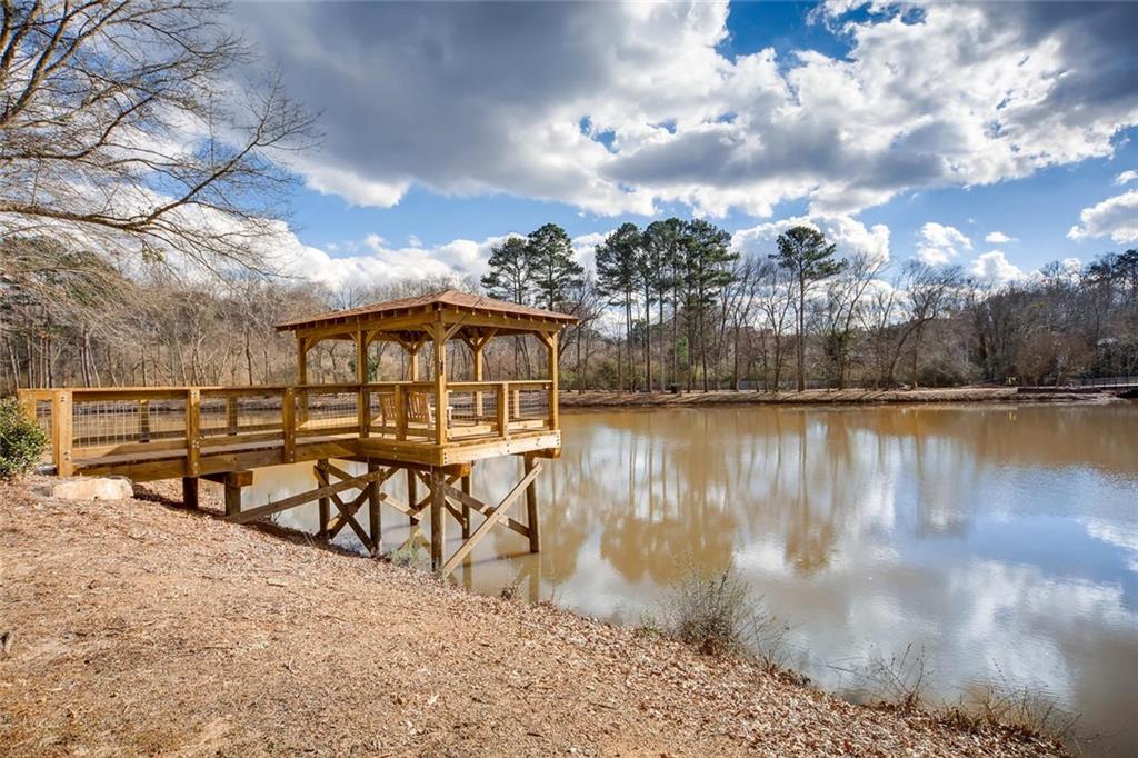 1800 Clairmont Lake, Unit A325 Decatur, GA 30033 - Photo 43 of 51 a view of a lake with a table and chairs
