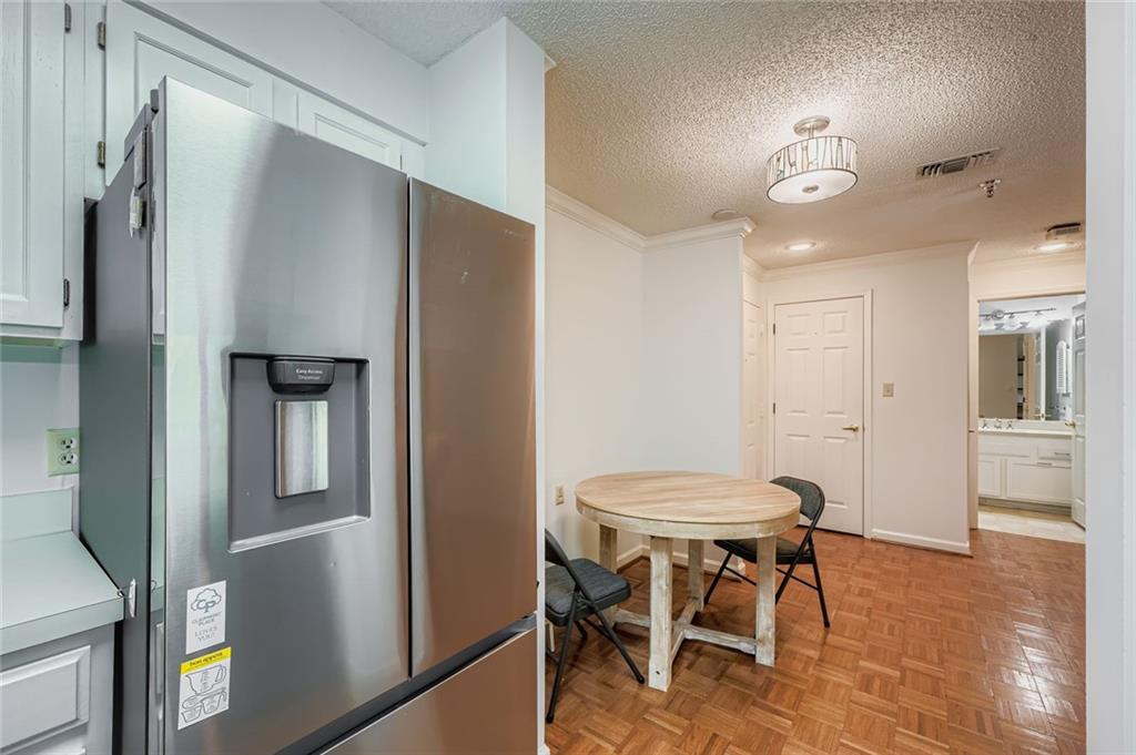 1800 Clairmont Lake, Unit A325 Decatur, GA 30033 - Photo 6 of 51 a view of a dining room with furniture and wooden floor