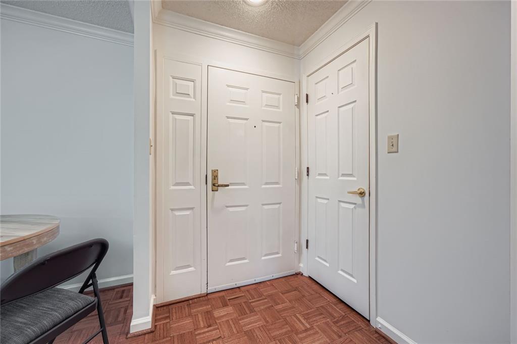 1800 Clairmont Lake, Unit A325 Decatur, GA 30033 - Photo 8 of 51 a view of room with walk in closet and wooden floor