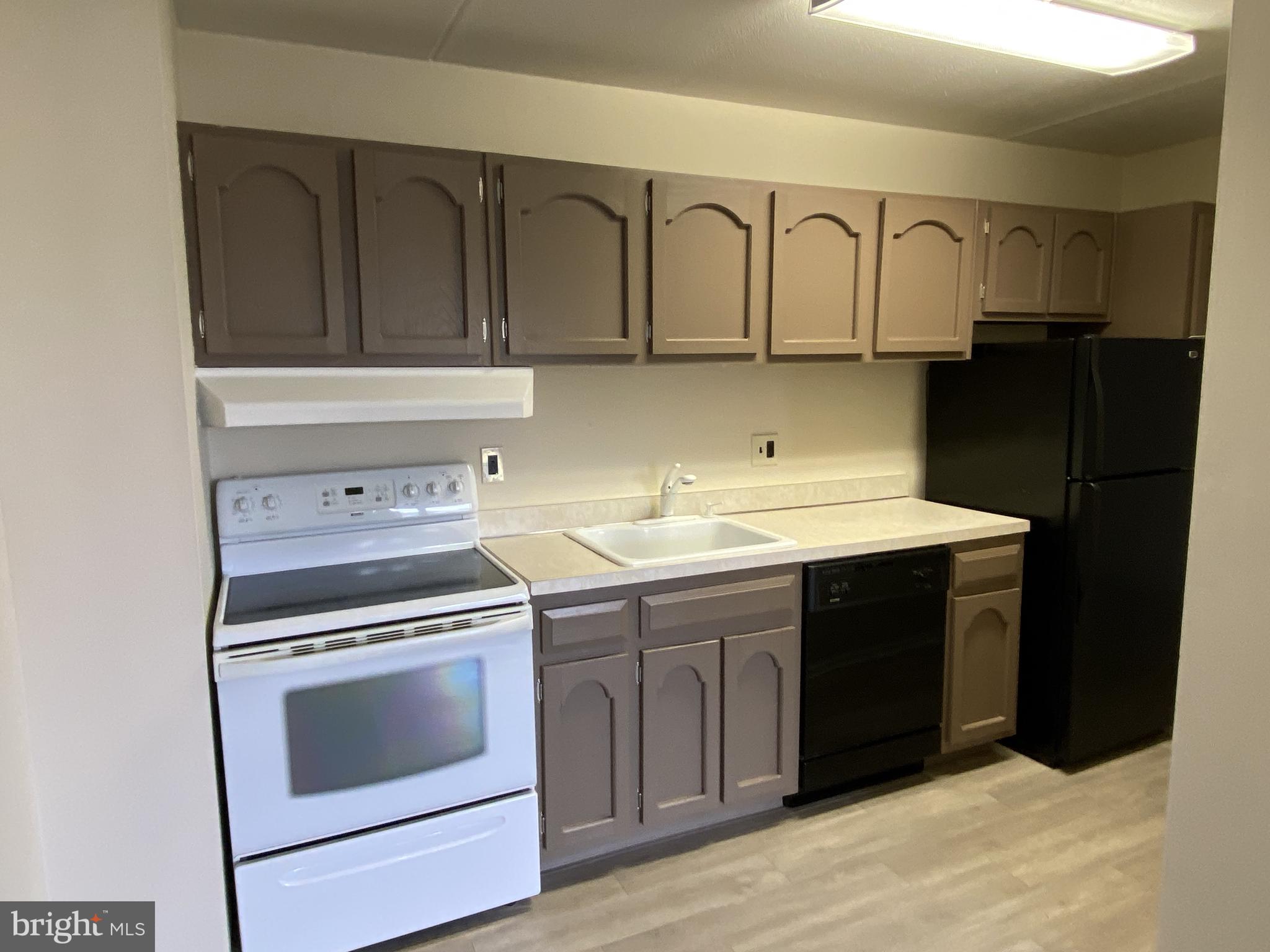68 Welsh Tract Road, Unit 204 Newark, DE 19713 - Photo 7 of 17 View of Galley Kitchen w/ Freshly Painted Cabinets