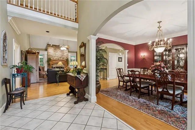 a living room with patio furniture and a potted plant