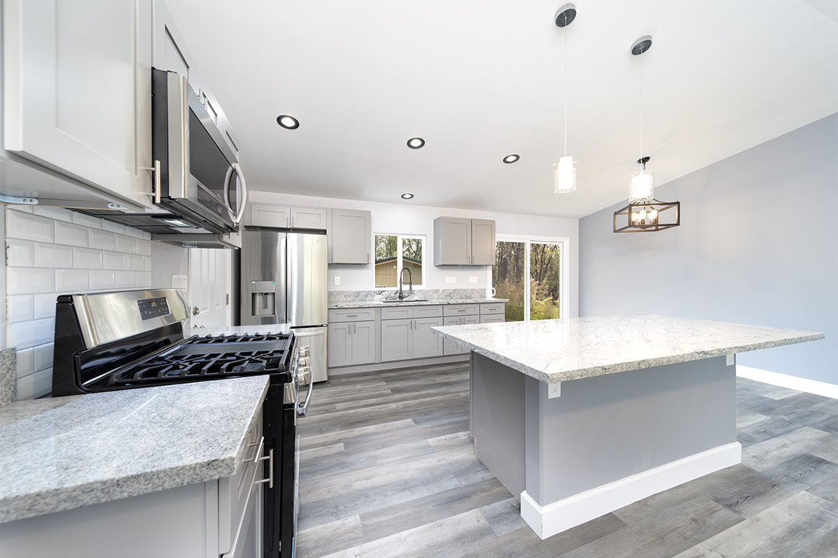 11-3115 Mokuna Street Mountain View, HI 96771 - Photo 12 of 30 a kitchen with counter top space and stove