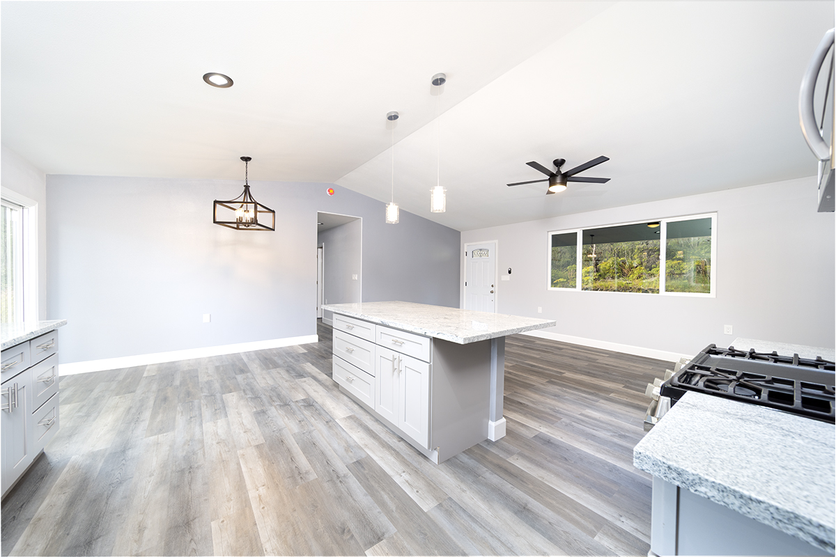11-3115 Mokuna Street Mountain View, HI 96771 - Photo 14 of 30 a view of kitchen with sink and wooden floor