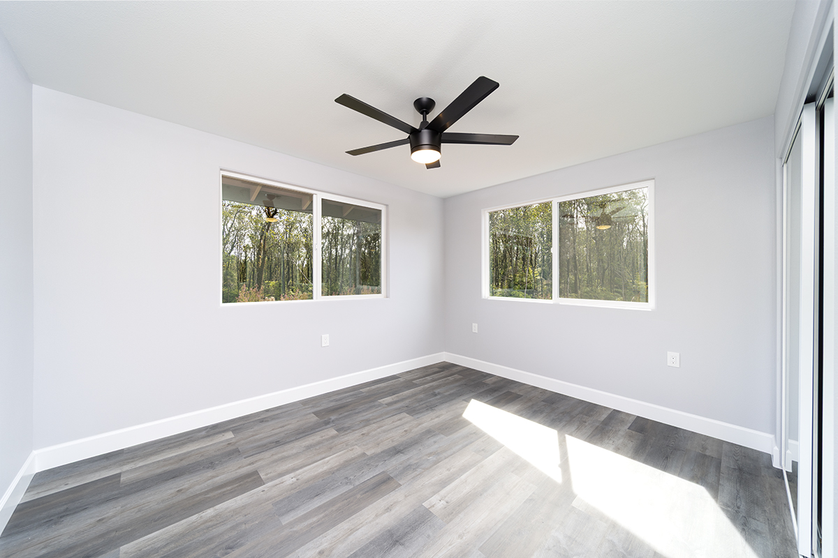 11-3115 Mokuna Street Mountain View, HI 96771 - Photo 19 of 30 a view of a livingroom with a ceiling fan and window