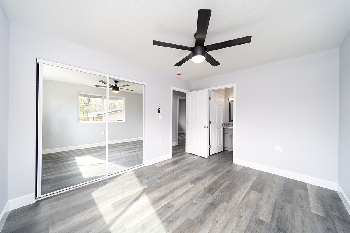 11-3115 Mokuna Street Mountain View, HI 96771 - Photo 20 of 30 a view of empty room with wooden floor and window