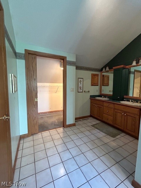 1126 Mudbrook Road Huron, OH 44839 - Photo 9 of 22 Kitchen featuring sink, light tile floors, and vaulted ceiling