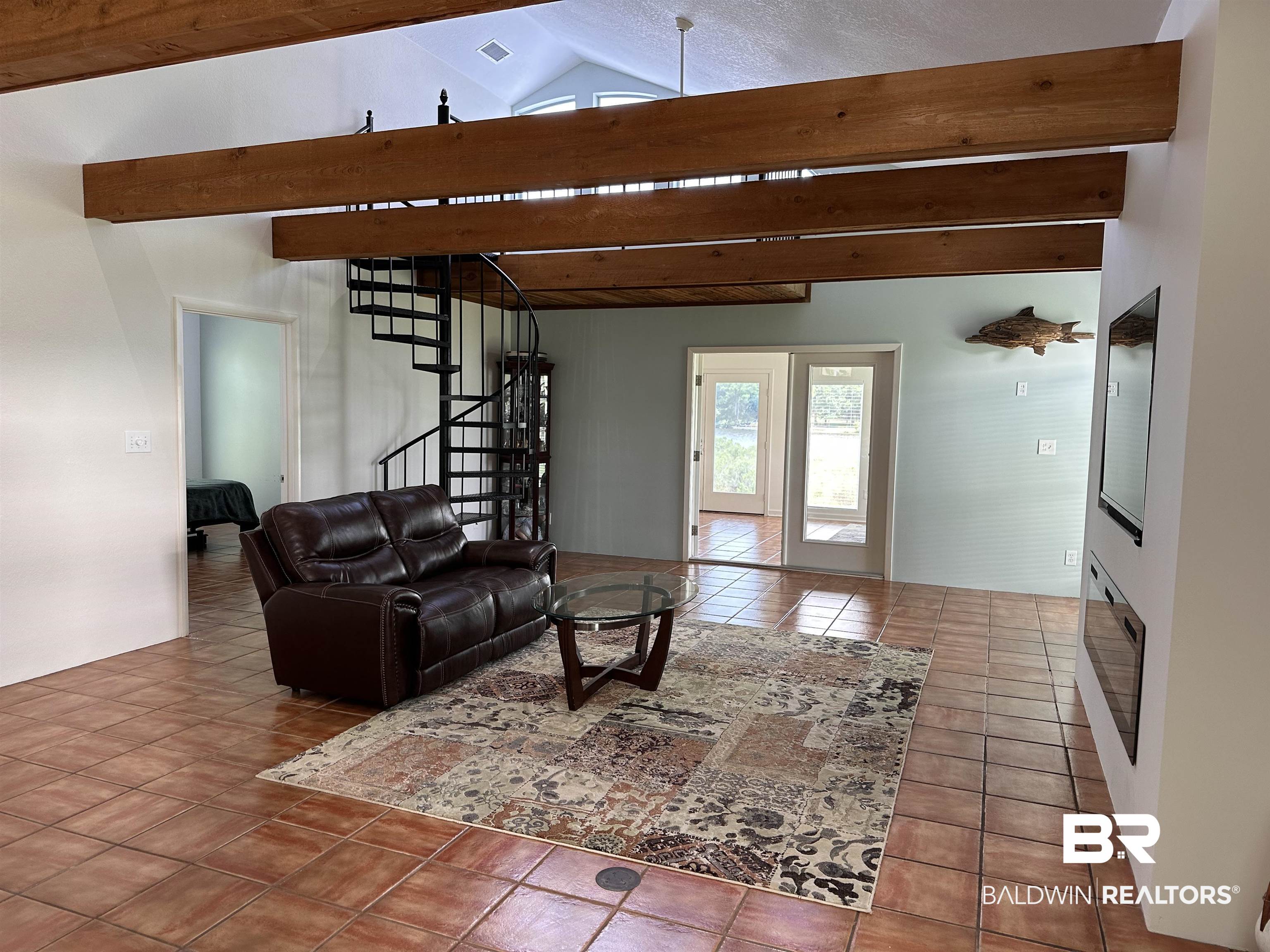 6880 Piney Woods Road Foley, AL 36535 - Photo 10 of 30 Tiled living room featuring lofted ceiling with beams