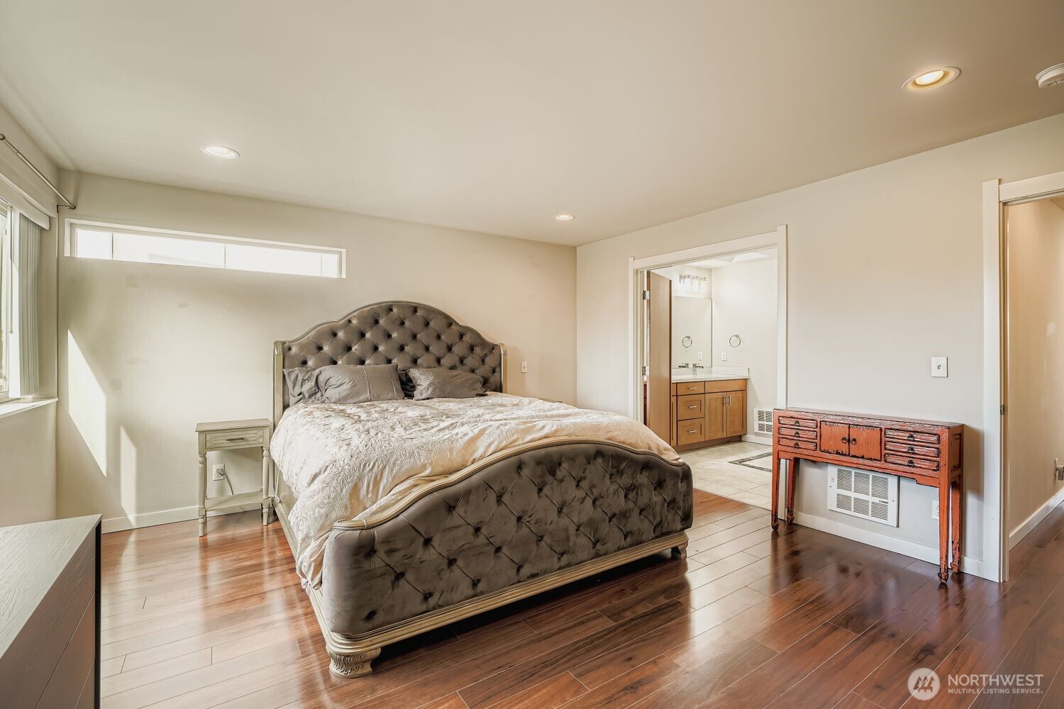 12420 2nd Place Southwest Seattle, WA 98146 - Photo 19 of 31 a bedroom with a bed and wooden floor