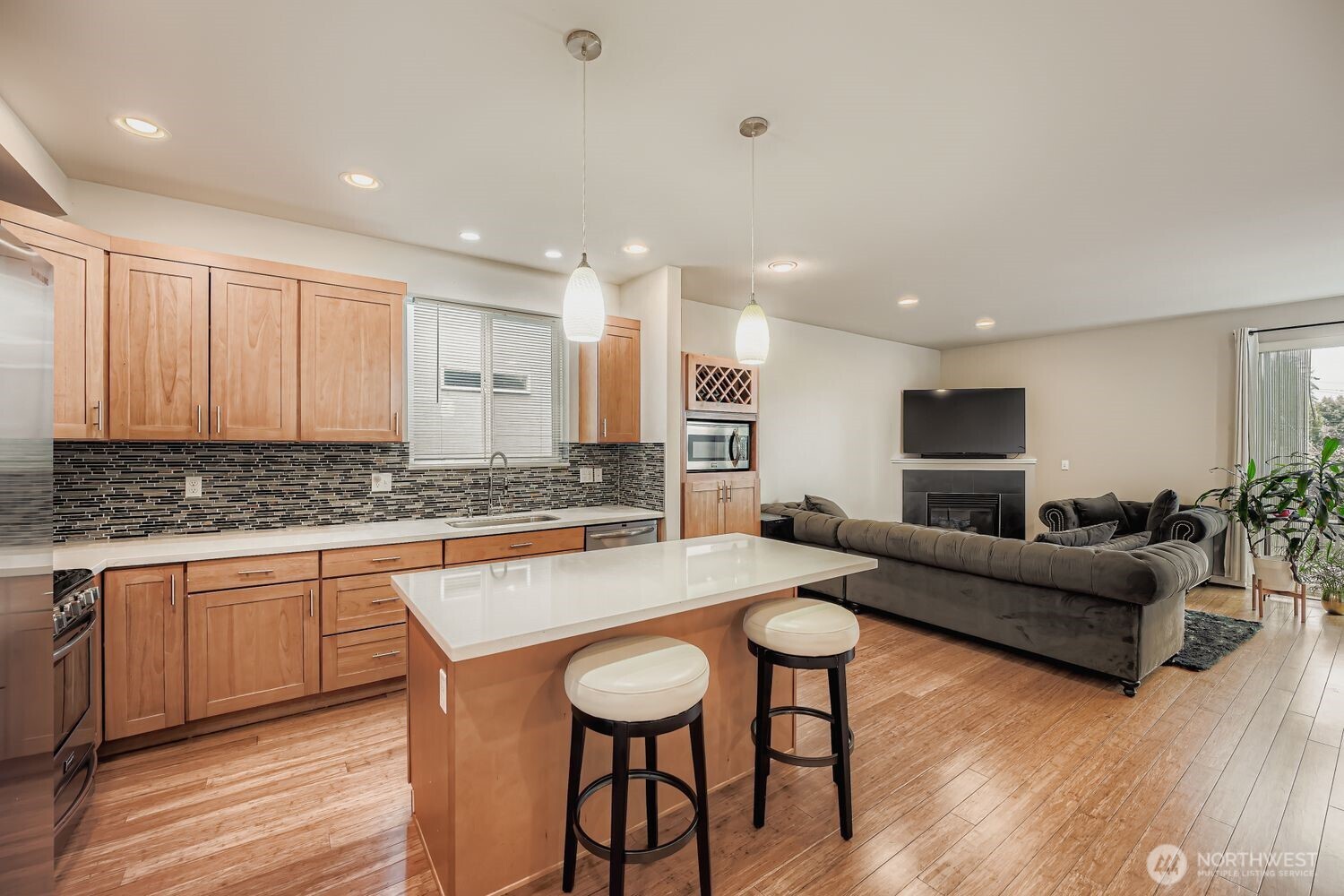 12420 2nd Place Southwest Seattle, WA 98146 - Photo 9 of 31 a living room with stainless steel appliances granite countertop furniture and wooden floor