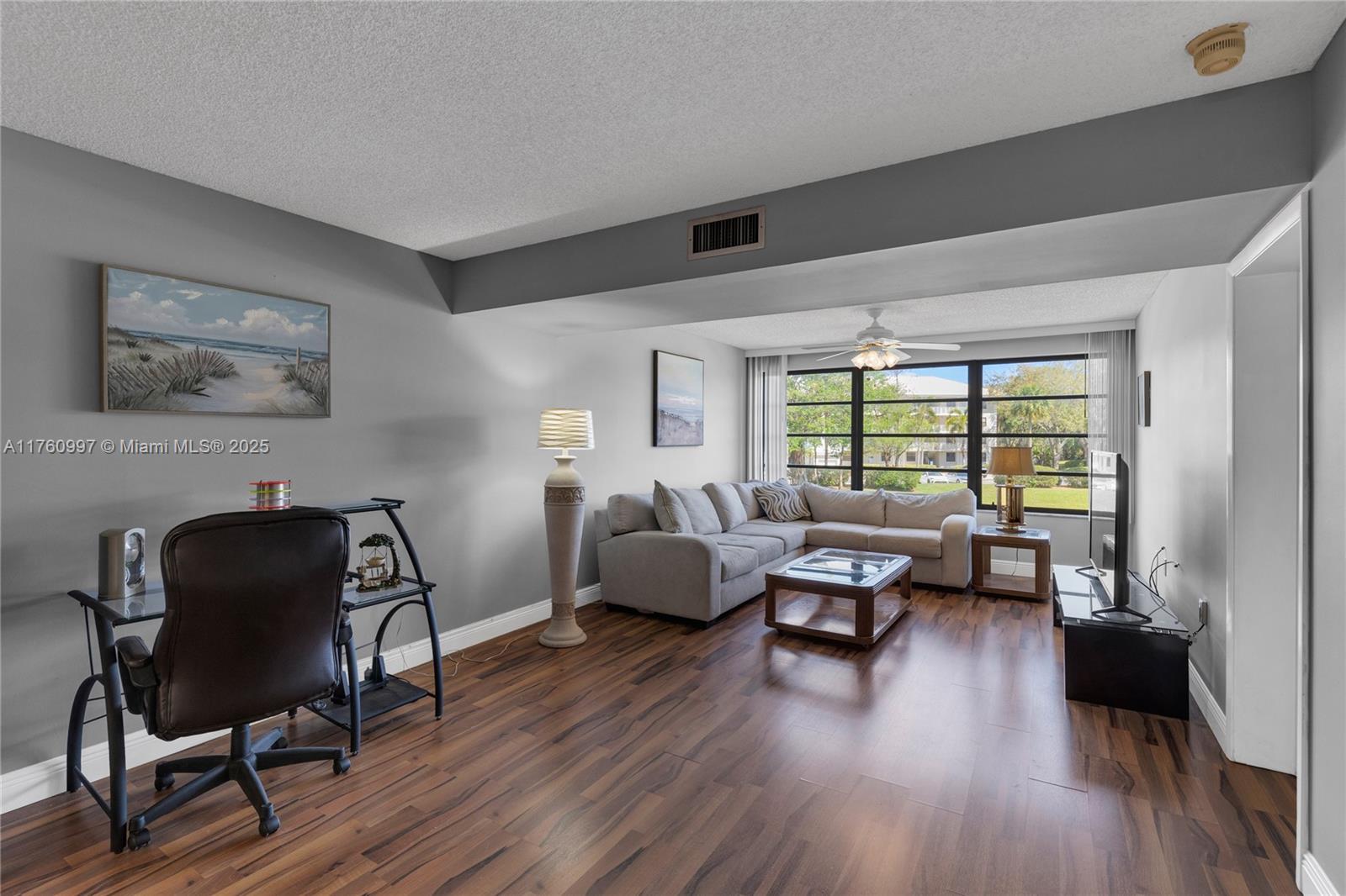 6025 Balboa Circle, Unit 204 Boca Raton, FL 33433 - Photo 18 of 38 a living room with furniture and wooden floor