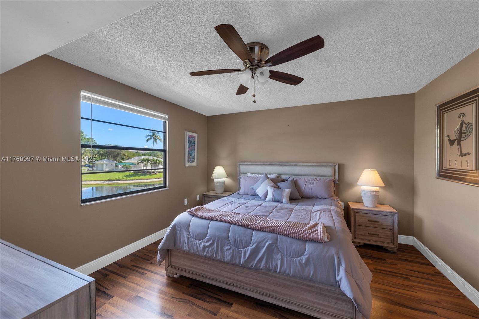 6025 Balboa Circle, Unit 204 Boca Raton, FL 33433 - Photo 24 of 38 a bedroom with a large bed and a window