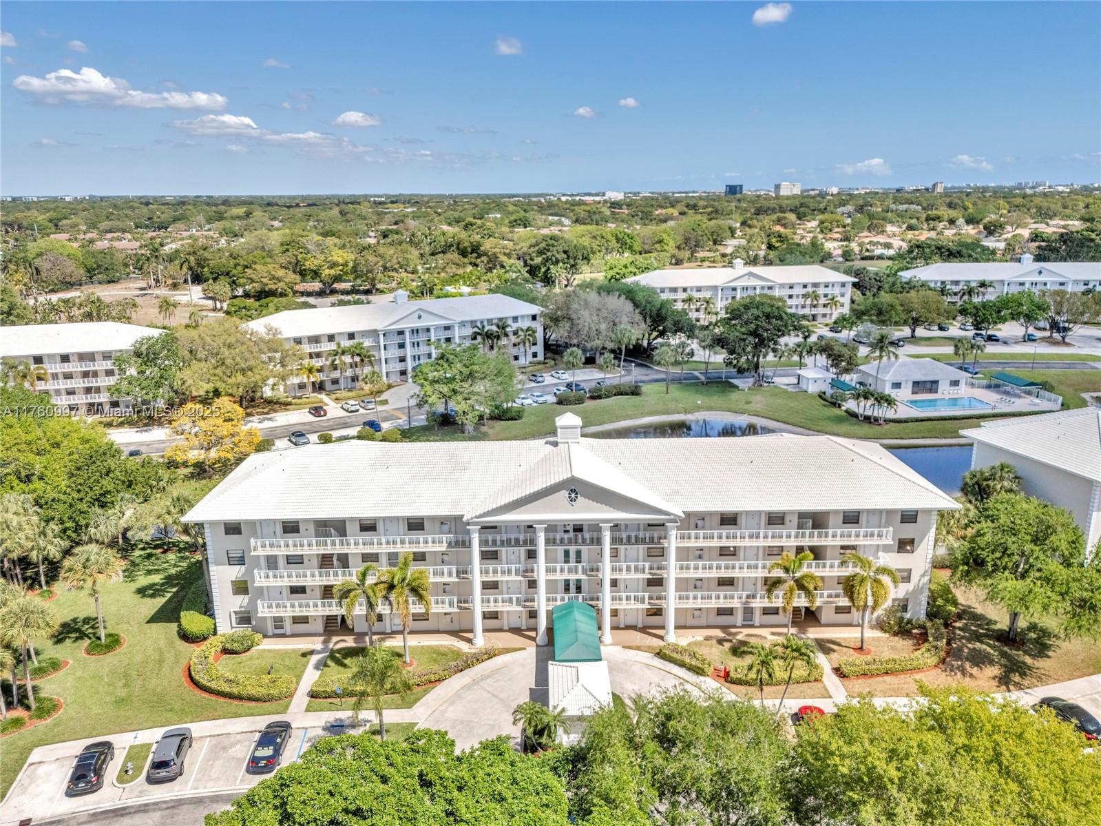 6025 Balboa Circle, Unit 204 Boca Raton, FL 33433 - Photo 35 of 38 a view of a swimming pool and lake view