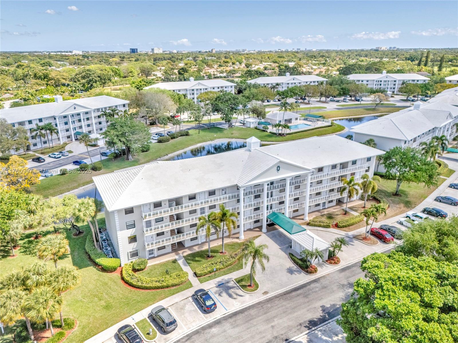 6025 Balboa Circle, Unit 204 Boca Raton, FL 33433 - Photo 36 of 38 an aerial view of residential houses with outdoor space and ocean view