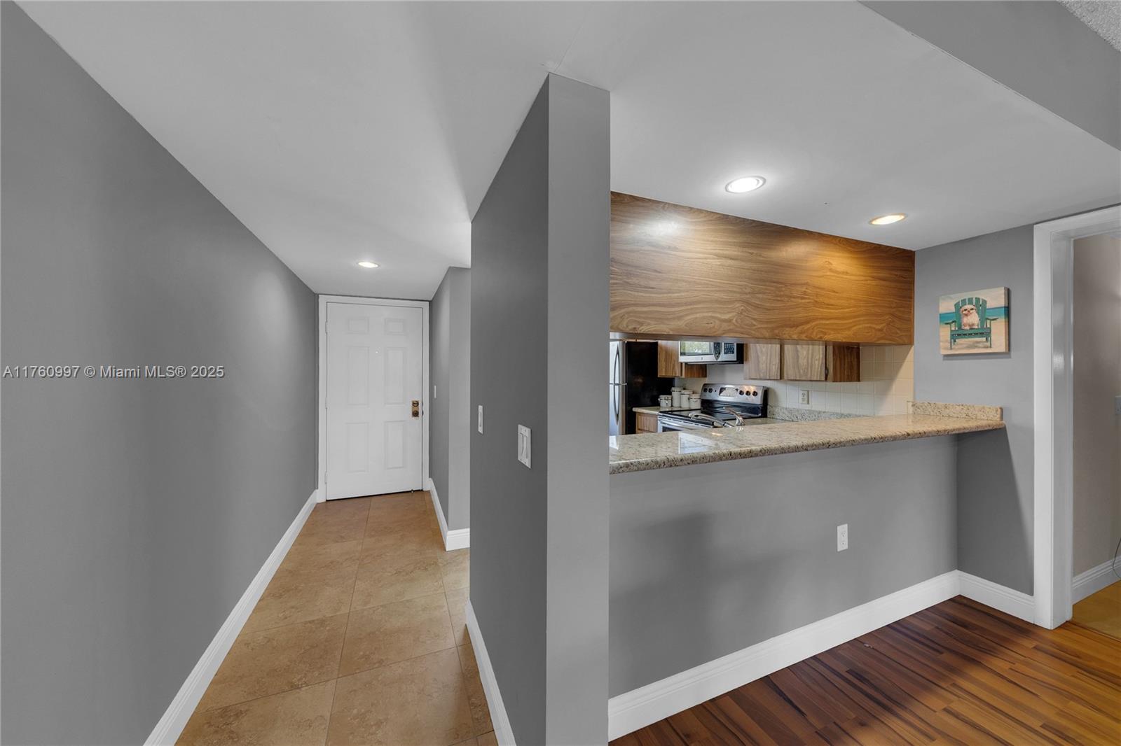 6025 Balboa Circle, Unit 204 Boca Raton, FL 33433 - Photo 4 of 38 a view of a kitchen with a sink and cabinets