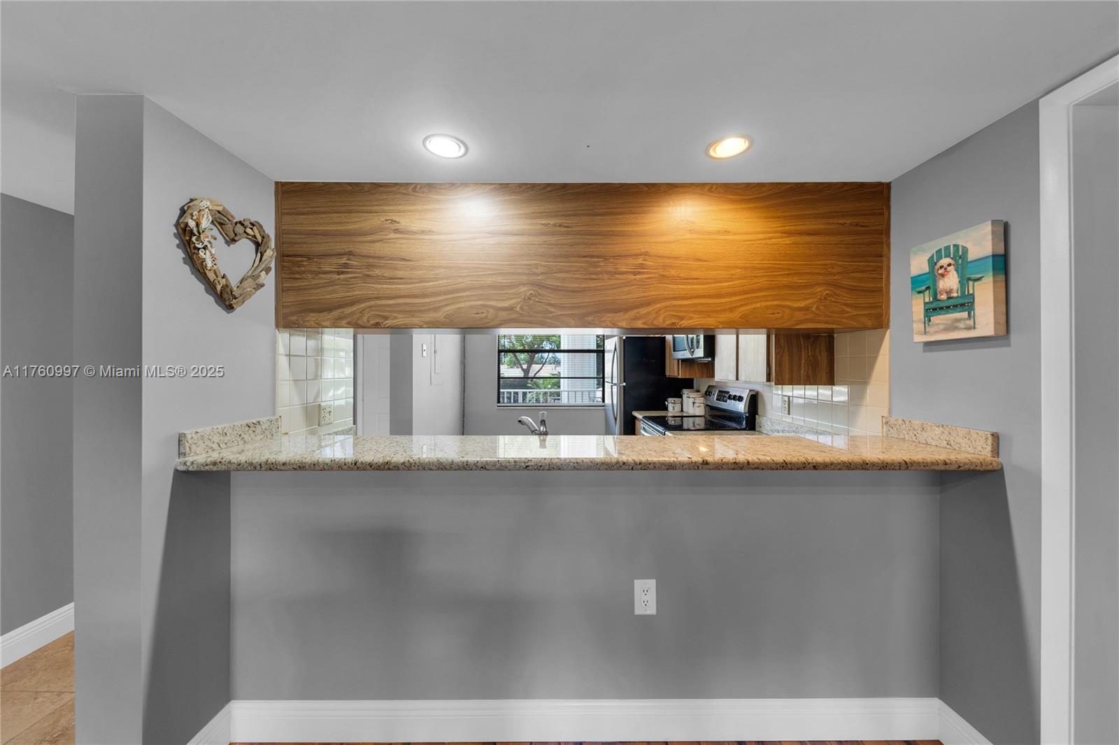 6025 Balboa Circle, Unit 204 Boca Raton, FL 33433 - Photo 8 of 38 a view of living room with furniture and window