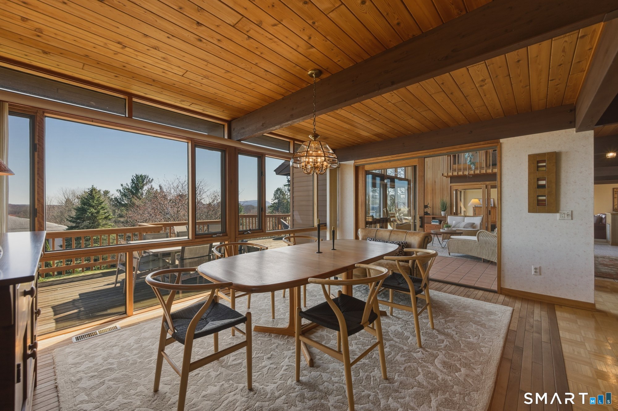 279 Mooreland Road Berlin, CT 06037 - Photo 40 of 40 Open concept floor plan with dining room open to kitchen and living room. Floor to ceiling windows, gorgeous tongue and groove cedar ceilings with beams.