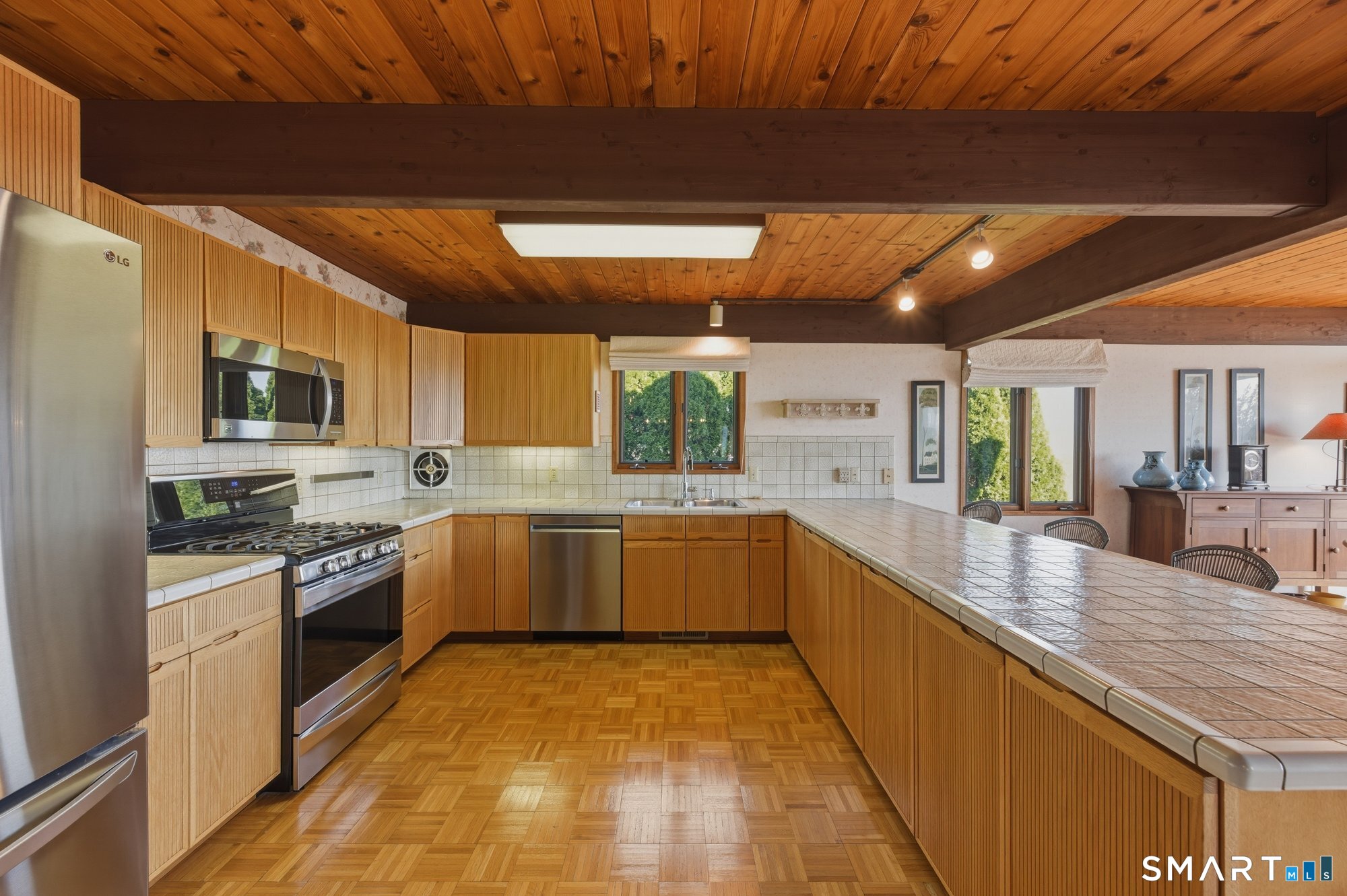 279 Mooreland Road Berlin, CT 06037 - Photo 10 of 40 Beautiful gourmet kitchen with stainless steel appliances, quality wood detailed cabinets, breakfast bar, beams, cedar tongue and groove ceilings.