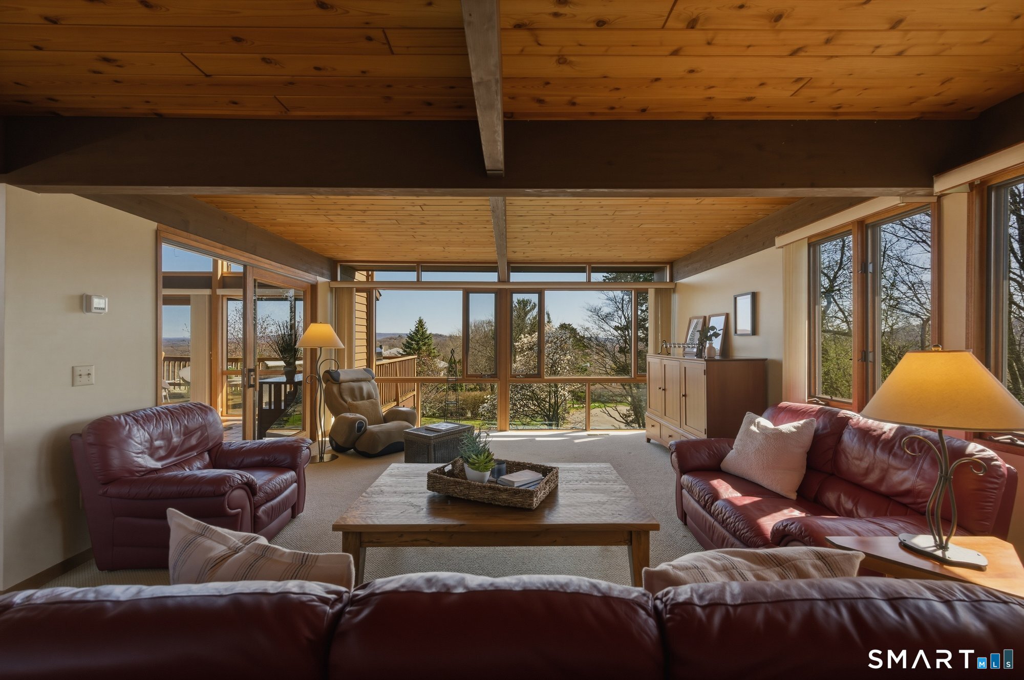 279 Mooreland Road Berlin, CT 06037 - Photo 13 of 40 Spacious family room with floor to ceiling windows, beams, tongue and groove cedar ceilings.