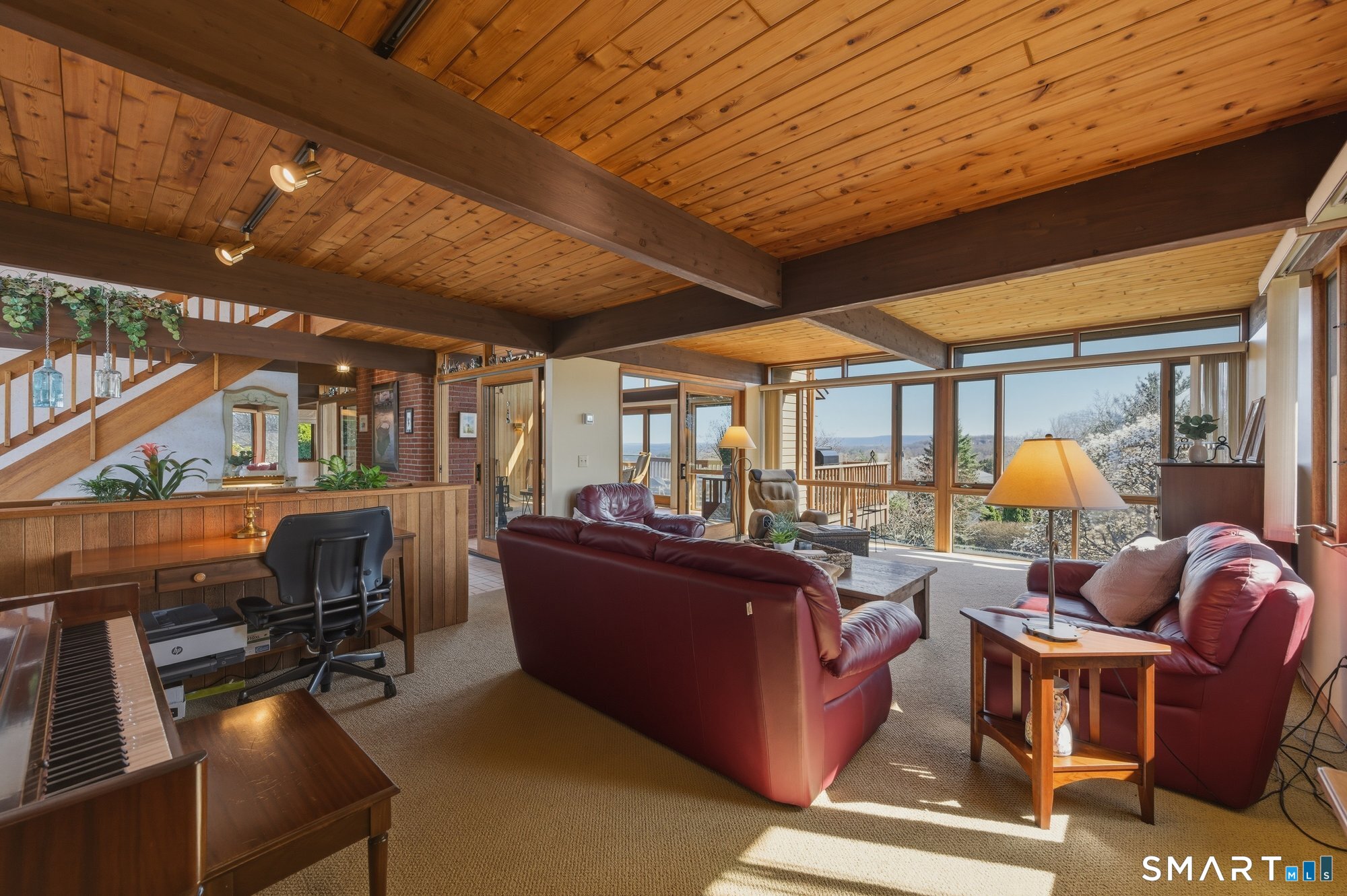 279 Mooreland Road Berlin, CT 06037 - Photo 14 of 40 Spacious family room with floor to ceiling windows, beams, tongue and groove cedar ceilings.