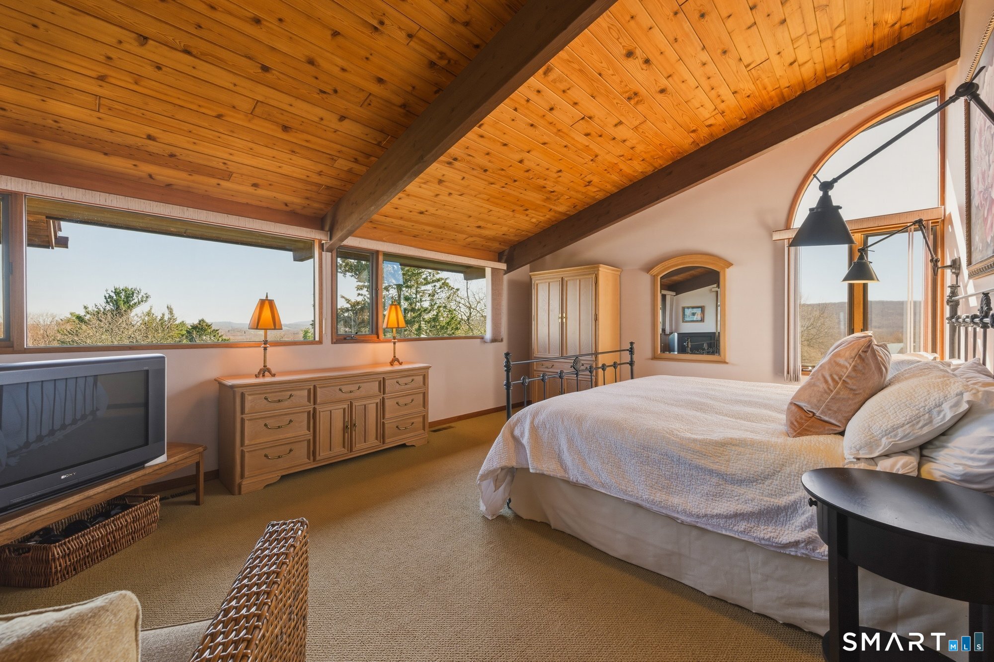 279 Mooreland Road Berlin, CT 06037 - Photo 16 of 40 Primary bedroom suite. Features cathedral cedar ceiling with tongue and groove detailing and beams. Sunrise and sunset vista views from bedroom!