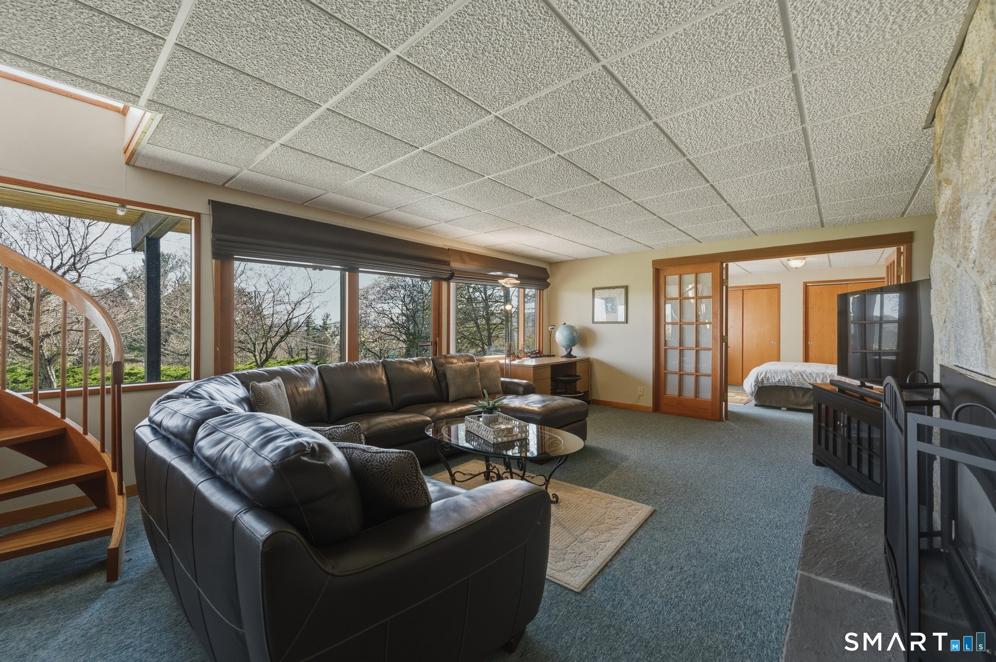 279 Mooreland Road Berlin, CT 06037 - Photo 28 of 40 Partially finished spacious lower level with walk out sliders to back yard and plenty of windows to let in the natural light.