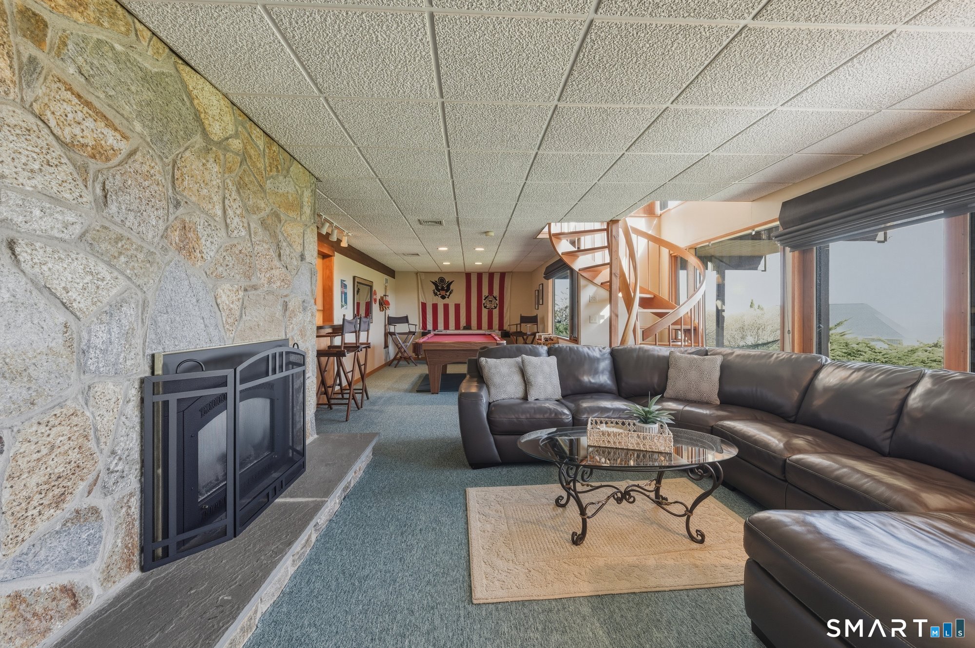 279 Mooreland Road Berlin, CT 06037 - Photo 29 of 40 Partially finished spacious lower level with walk out sliders to back yard and plenty of windows to let in the natural light. Beautiful fireplace.