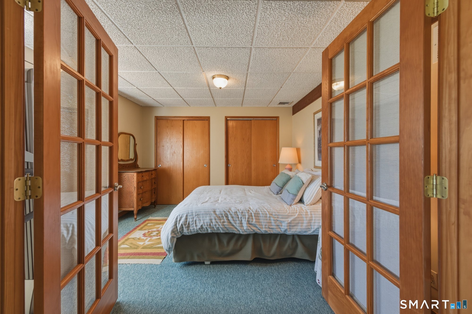 279 Mooreland Road Berlin, CT 06037 - Photo 30 of 40 4th bedroom lower level. French doors, plenty of closet space.