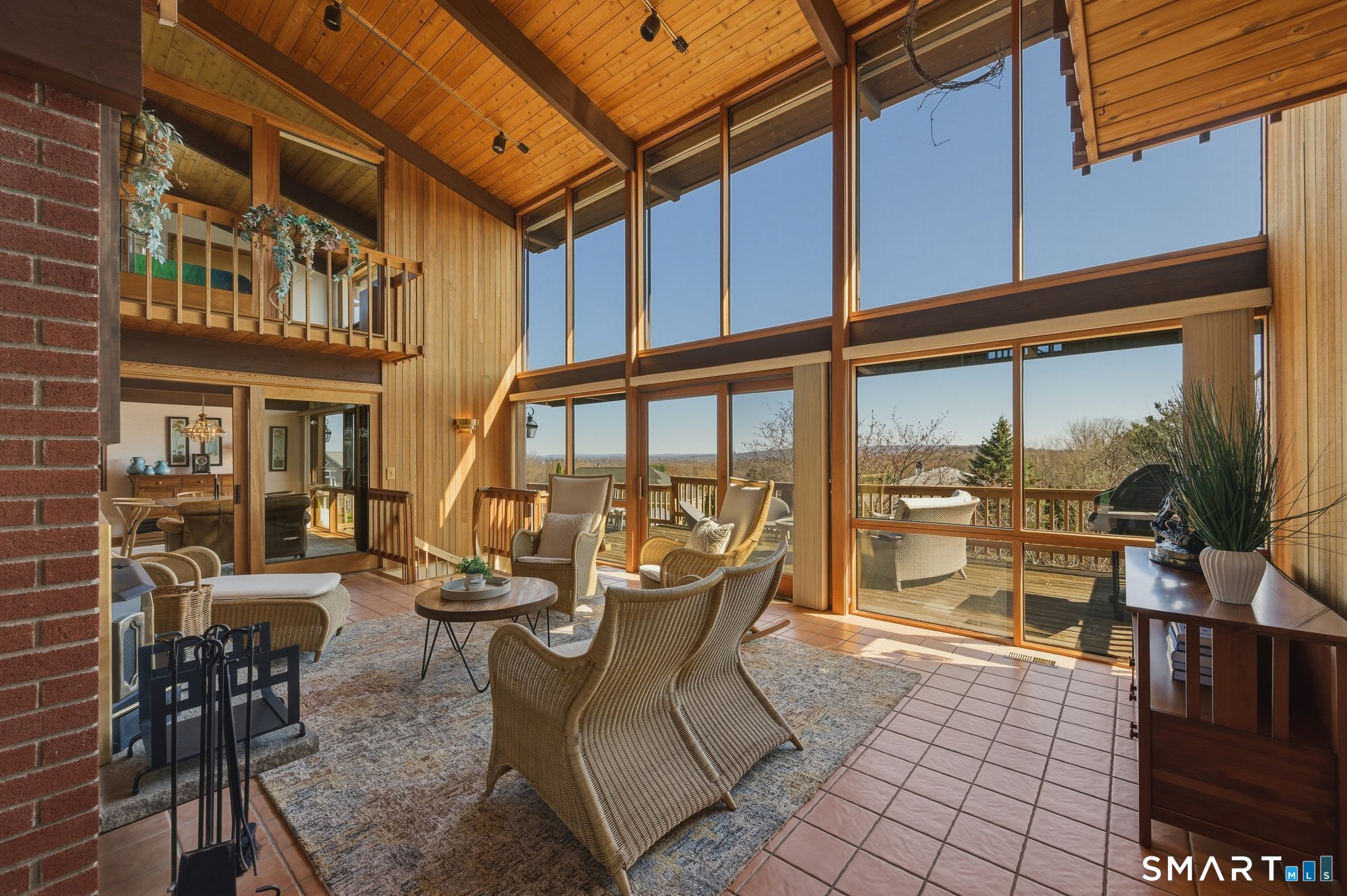 279 Mooreland Road Berlin, CT 06037 - Photo 7 of 40 Gorgeous vista views! Floor to ceiling two-story windows, cathedral ceilings with cedar tongue and groove architectural details. Mahogany trimmed windows. Sun-filled! Sliders to spacious deck.