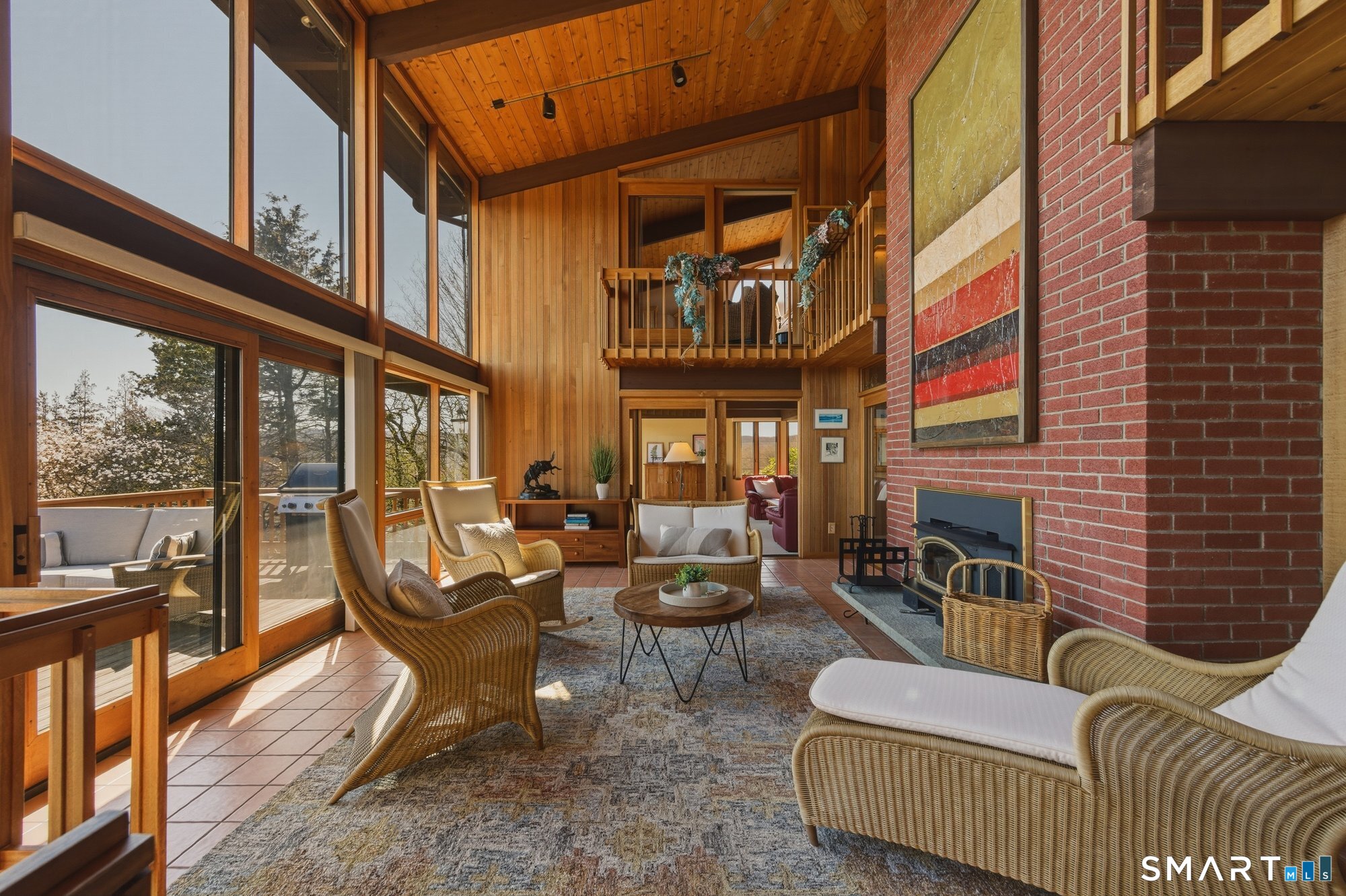 279 Mooreland Road Berlin, CT 06037 - Photo 8 of 40 Gorgeous vista views! Floor to ceiling two-story windows, cathedral ceilings with cedar tongue and groove architectural details. Mahogany trimmed windows. Sun-filled! Sliders to spacious deck.