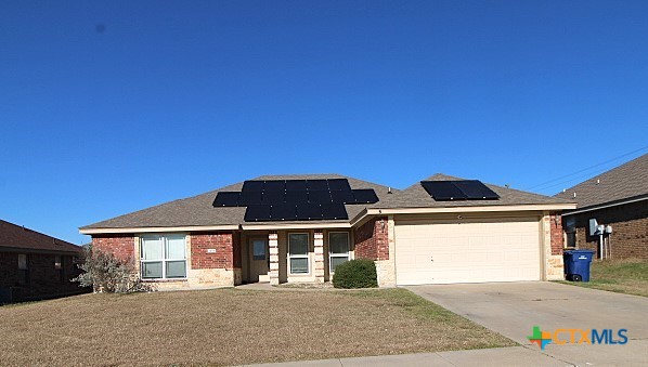 3404 Jacob Street Copperas Cove, TX 76522 - Photo 1 of 2 a front view of a house with a garden