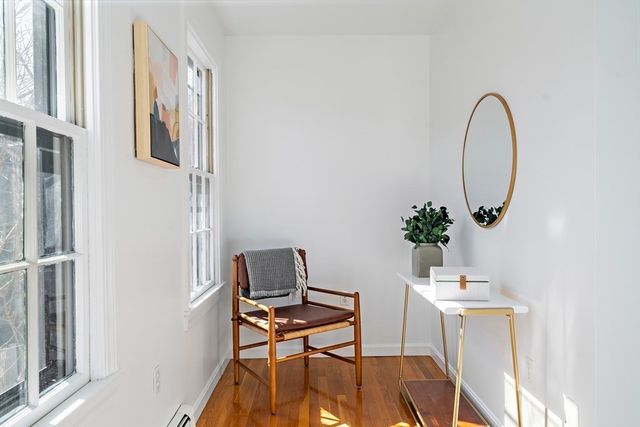 a view of a workspace with furniture and a potted plant