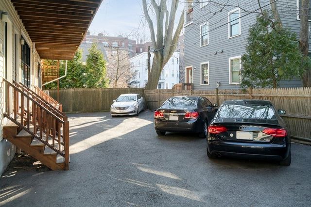 a view of a cars parked in front of a house